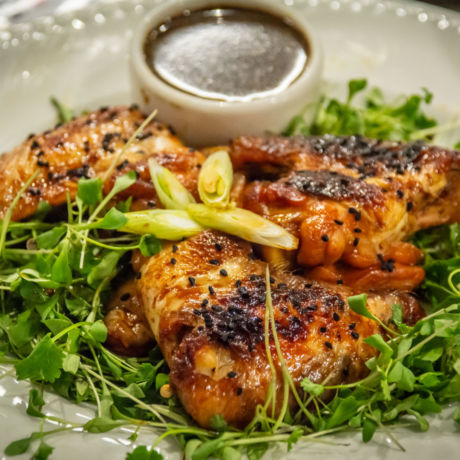 Close up of a plate of food. Salad and chicken