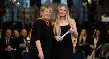 Daisy Trainor plumbing apprentice receiving her skills development award at the student celebration event
